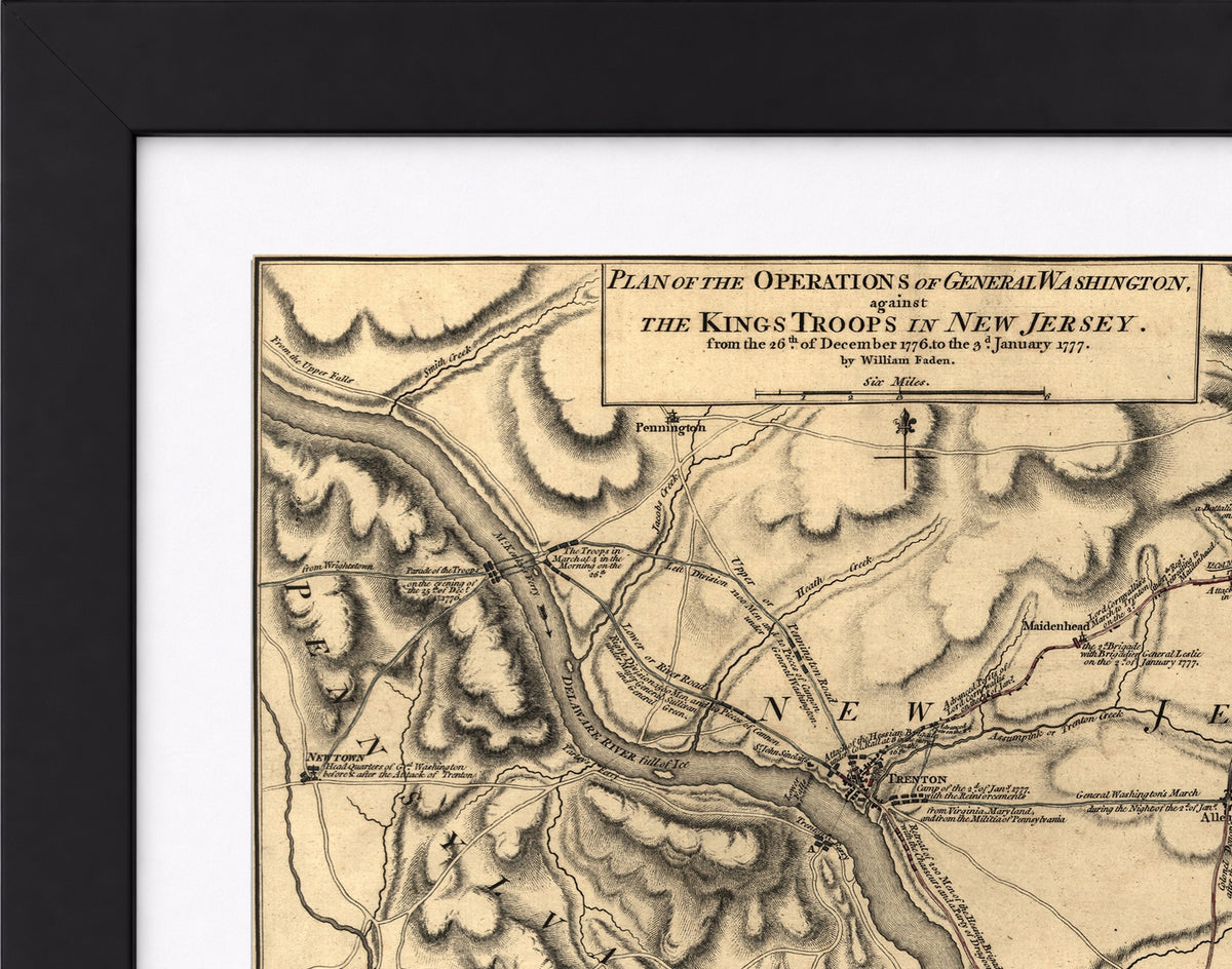A framed vintage map print showing historical military terrain details for 'The Kings Troop in New Jersey' with a black frame and white mat border.