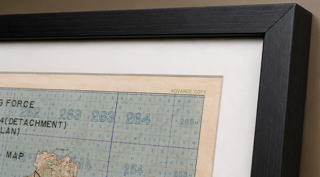 Close-up of Iwo Jima 1945 battle map with white mat and black wood frame