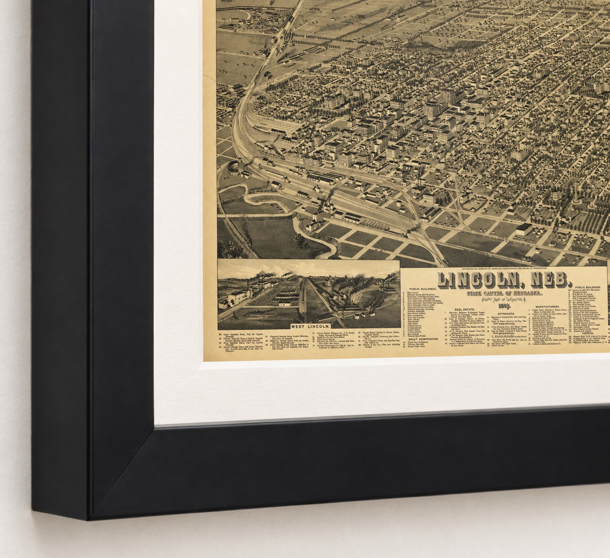 Lincoln, Nebraska 1889 bird’s-eye view map in a black frame, close-up of the corner with the West Lincoln inset and title