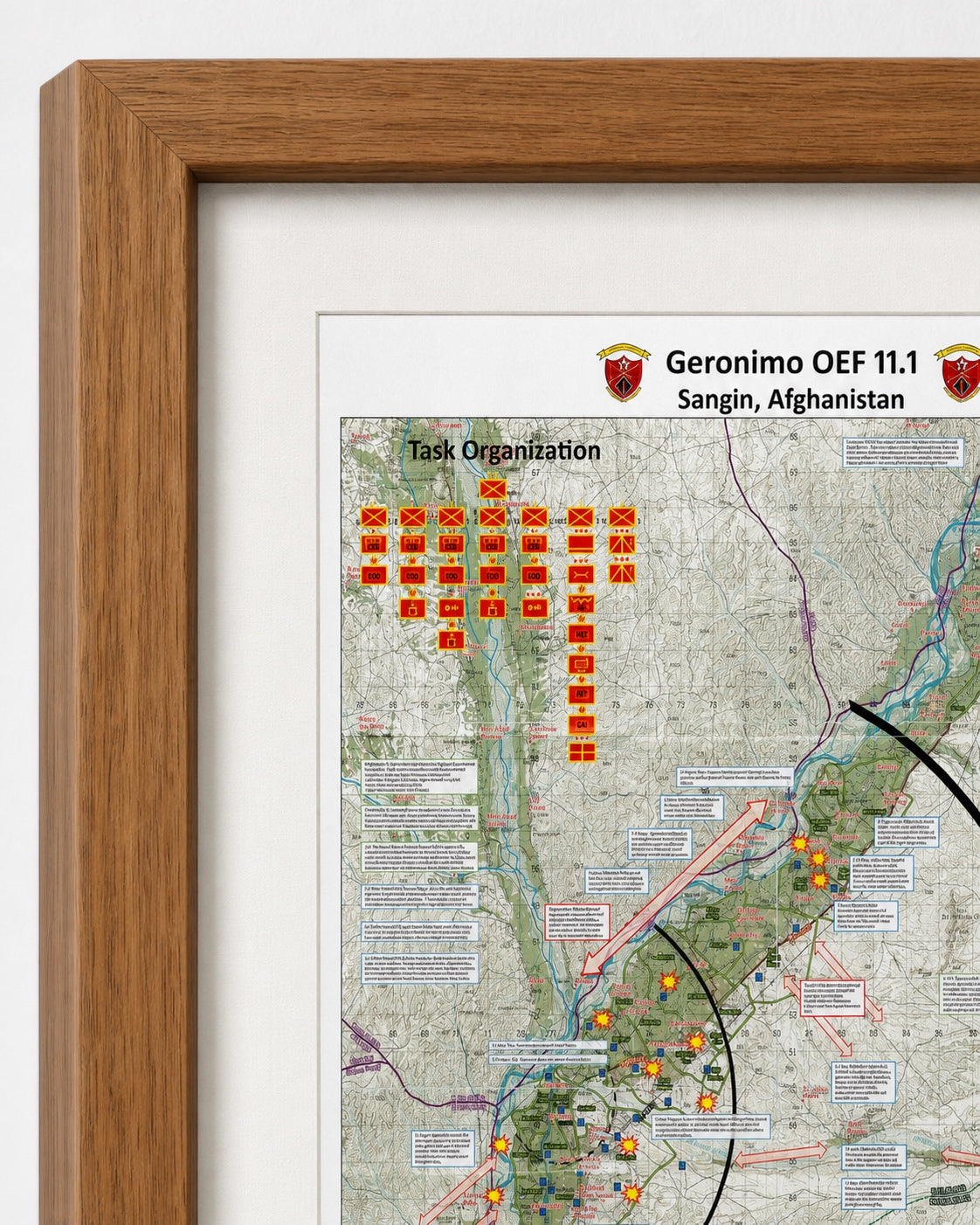 A framed military task organization map print for Geronimo OEF 11.1 in Sangin, Afghanistan, featuring a light wood frame, white matting, and a detailed map with red and orange unit markers.