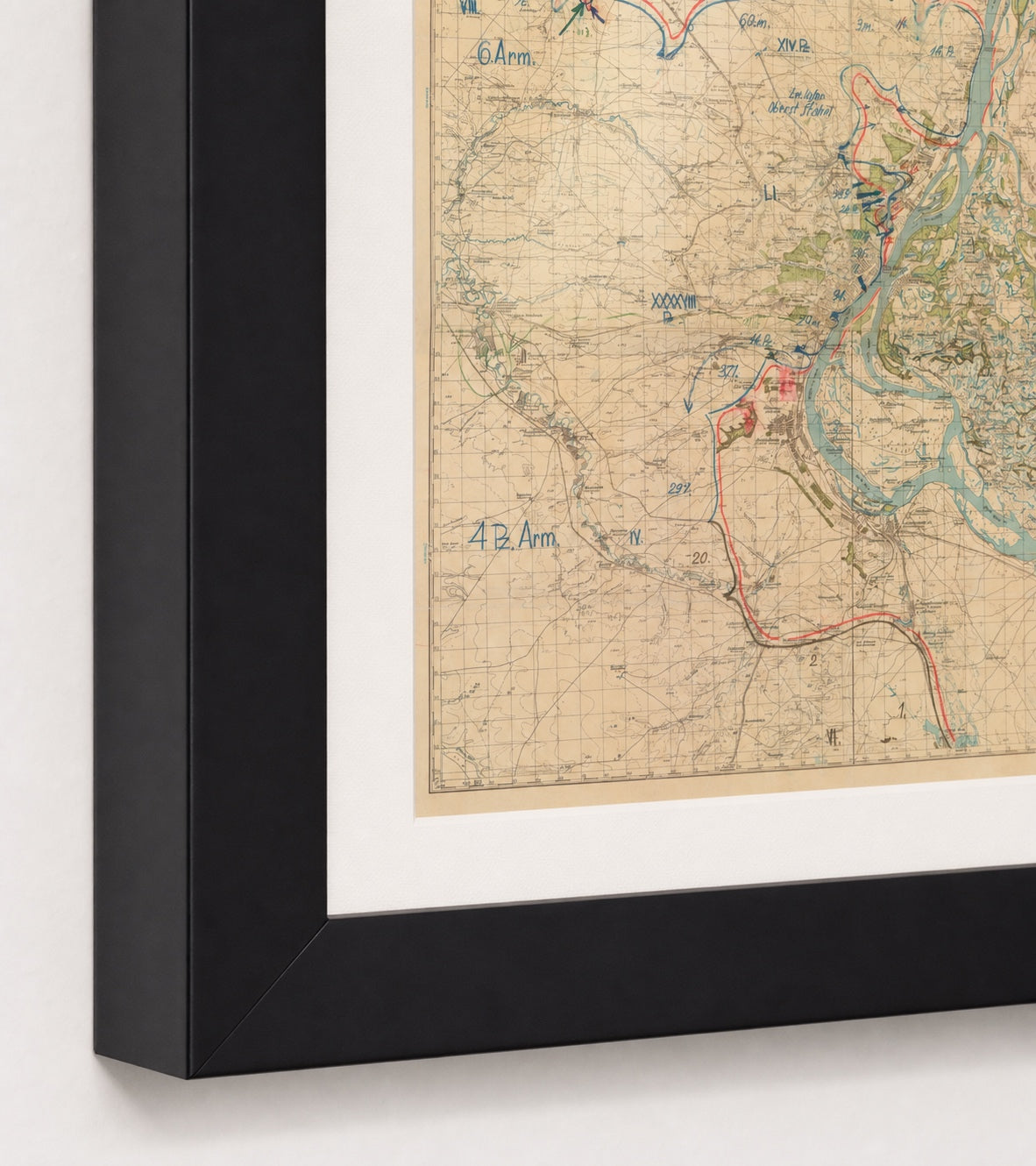 Battle of Stalingrad 1942 map in a Black frame close-up showing the mitered corner, archival-white mat, print surface, and glazing.
